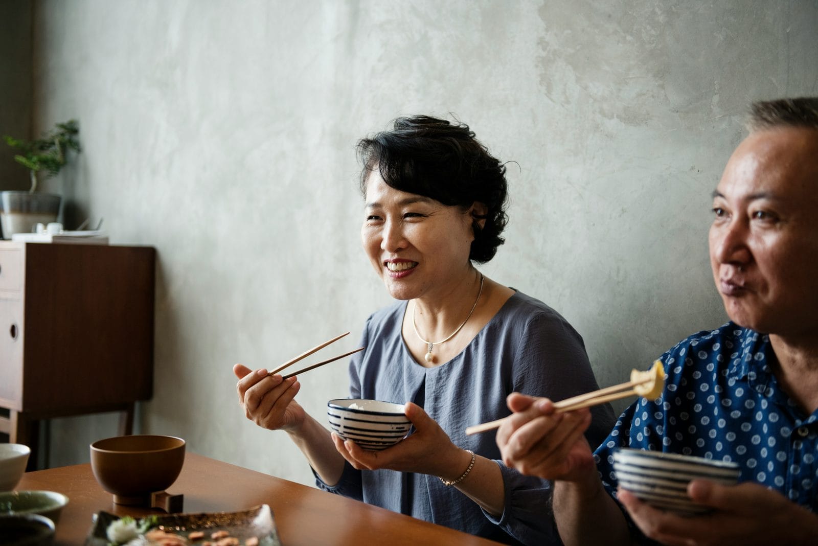 A couple sharing a meal together at a table