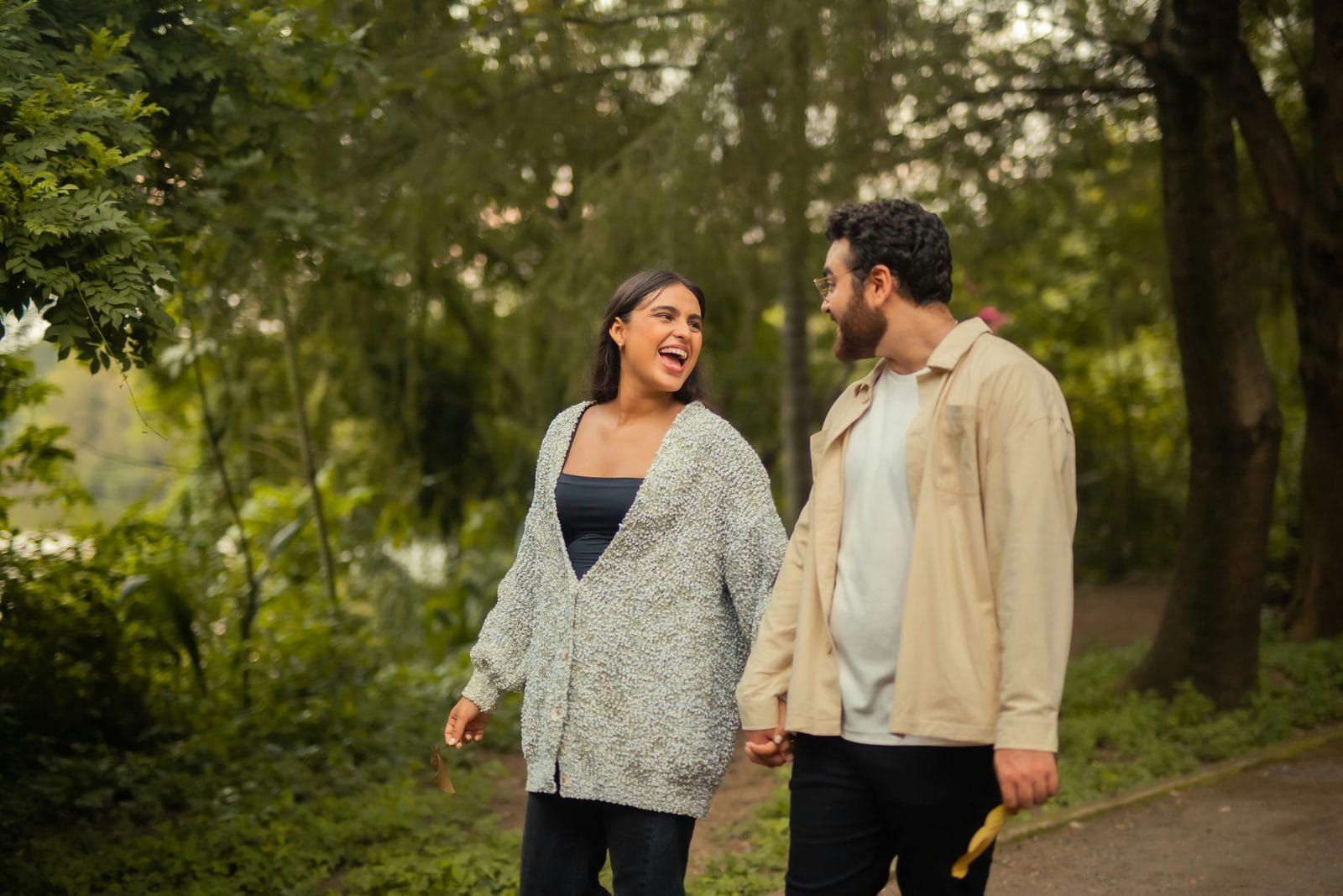 A couple walking together along a path outdoors
